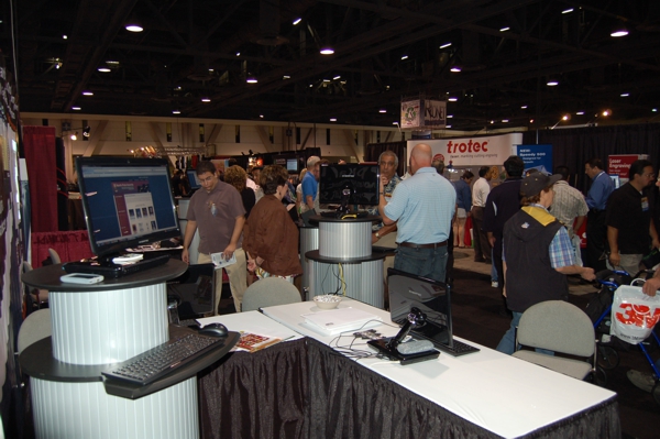 NBM Show in Long Beach, California 2010 Sheri Arnold and Niels Norby demonstrate awards shopping cart and BizWizard Order Manager order management software to prospective customers