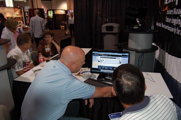 NBM Show in Long Beach, California 2010 Niels Norby giving hands on demonstration of BizWizard Order Management Software for Awards and Trophy Businesses to a prospective customer